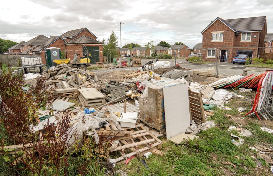 The disgusting heap also includes a portable toilet, old cardboard and road signs