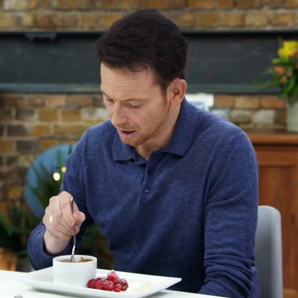 Joe, seen here tucking into Paul Chuckle's 'choc pot' dessert, on Masterchef