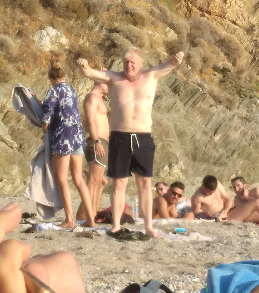 Boris Johnson stretches out on the sun-kissed sands of a Greek isle - only a week after returning from a spa holiday in Slovenia