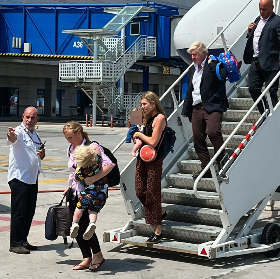 The PM had earlier been snapped arriving at Athens Airport at the weekend carrying Wilfred's kiddie backpack