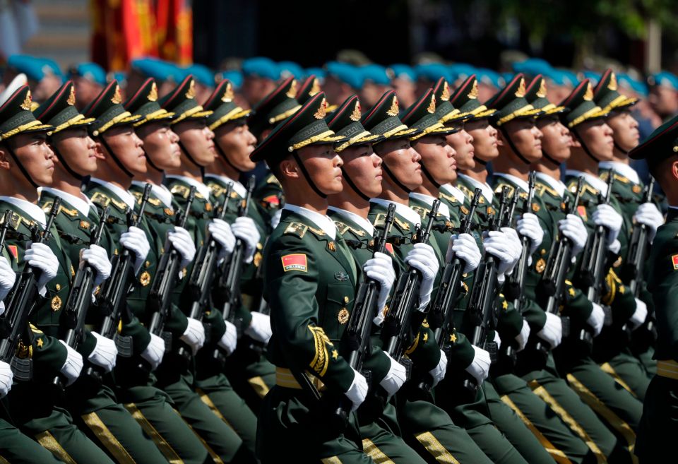 Soldiers from China’s People’s Liberation Army march on Red Square during a military parade