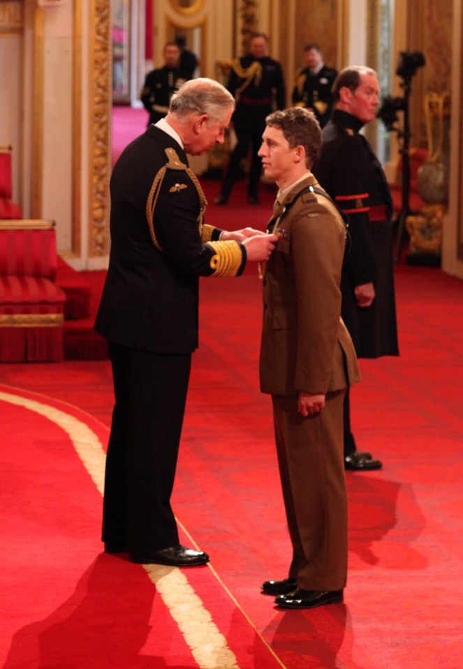 Ex-Rifles Serjeant Deacon Cutterham, here awarded by Prince Charles, said he grabbed a Taliban hand grenade and threw it away from his men in Afghanistan