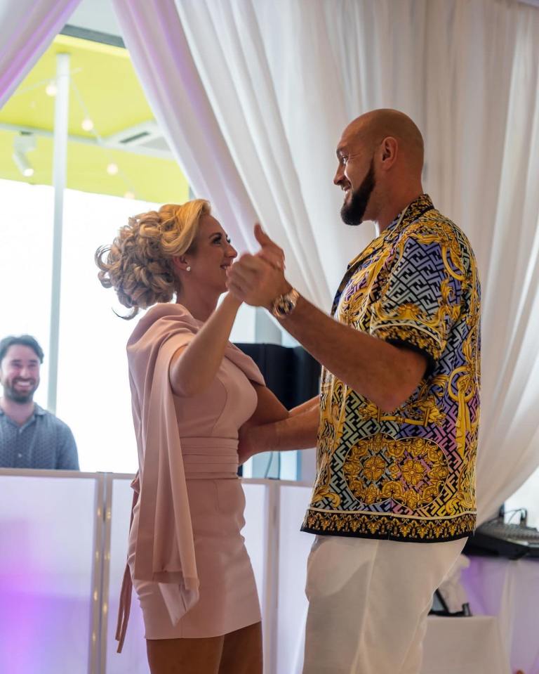 Tyson and Paris look in love as they dance at Athena's christening