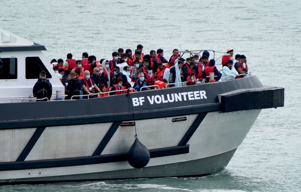 A Border Force vessel brings migrants to shore as 696 crossed the Channel to the UK on Monday