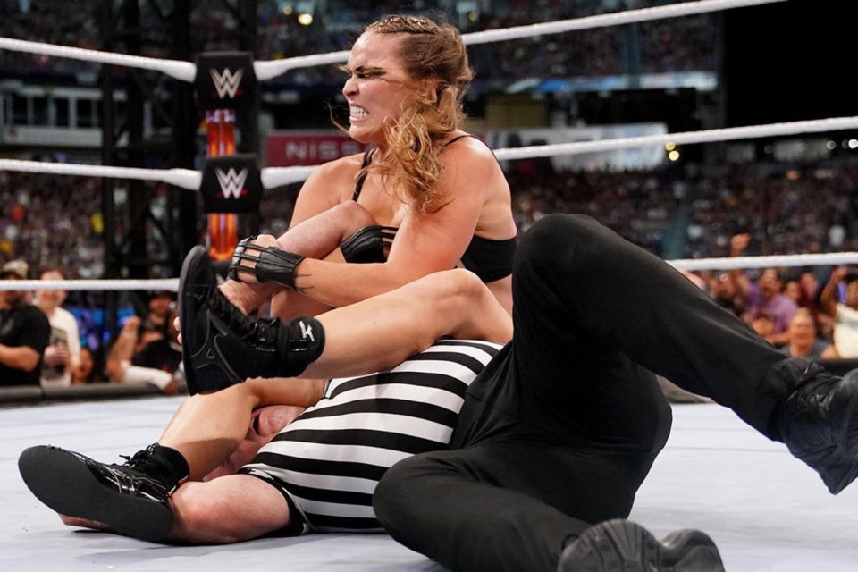 The UFC legend has been suspended by WWE after she attacked a referee afterwards