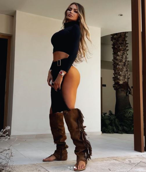 Chloe Sims wowed in a bikini and thigh-high boots as she posed up a storm for a sexy selfie