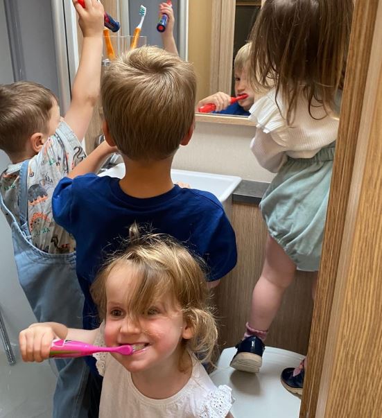 The kids pack into the bathroom at teethbrushing time