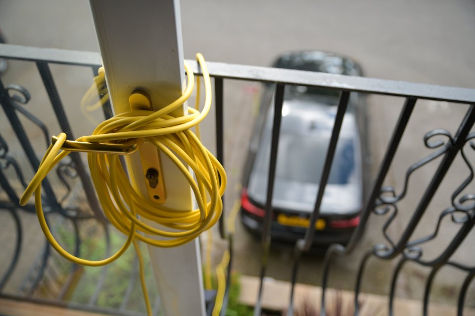 He has to stretch down a cord after he was ordered to remove his charging point