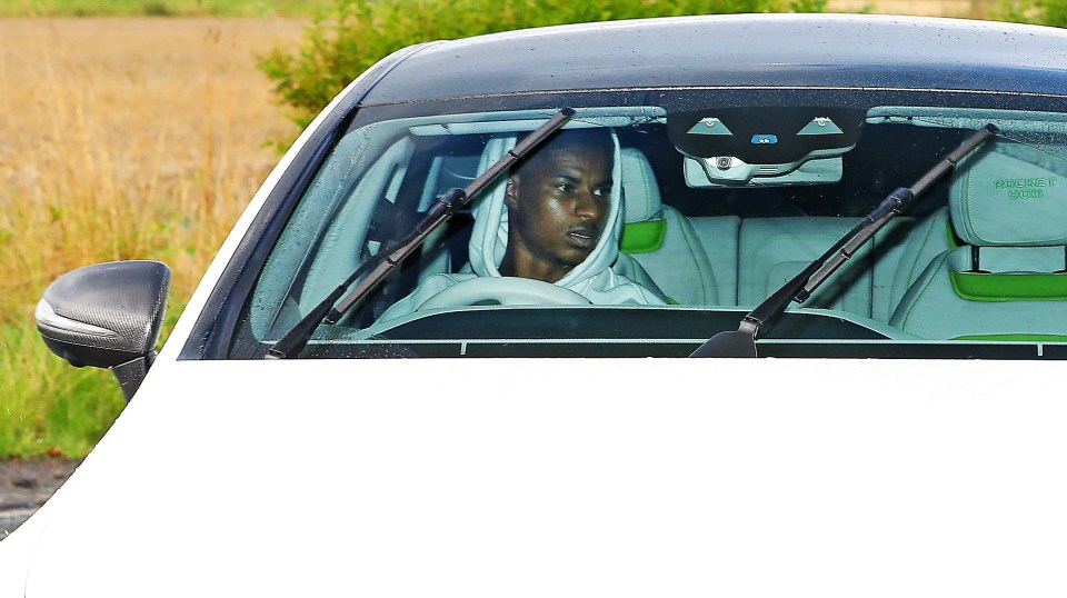 Marcus Rashford pulls up to training this morning