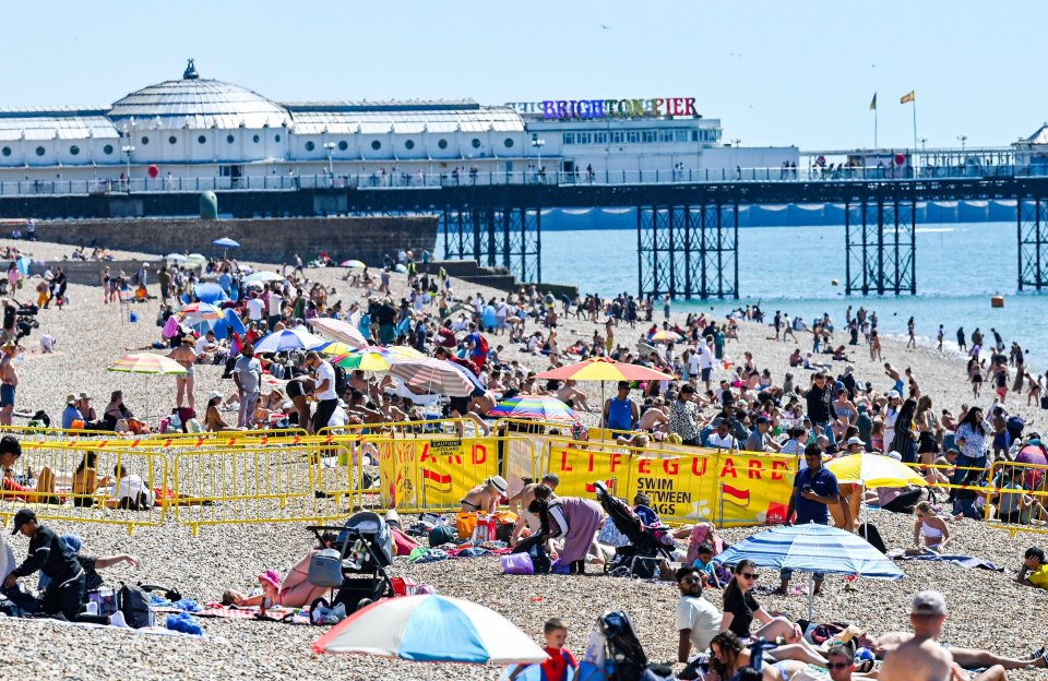 Beachgoers are starting to fill Brighton's seafront today