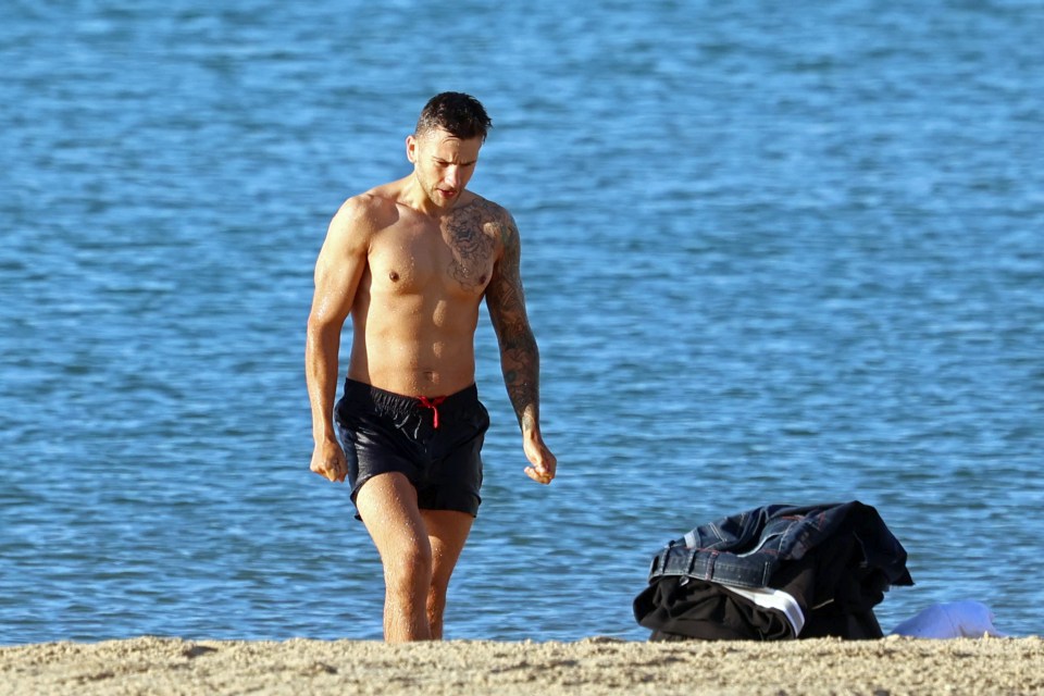 Swimmers hit the beach in Bournemouth early this morning as the temperatures start to rise again