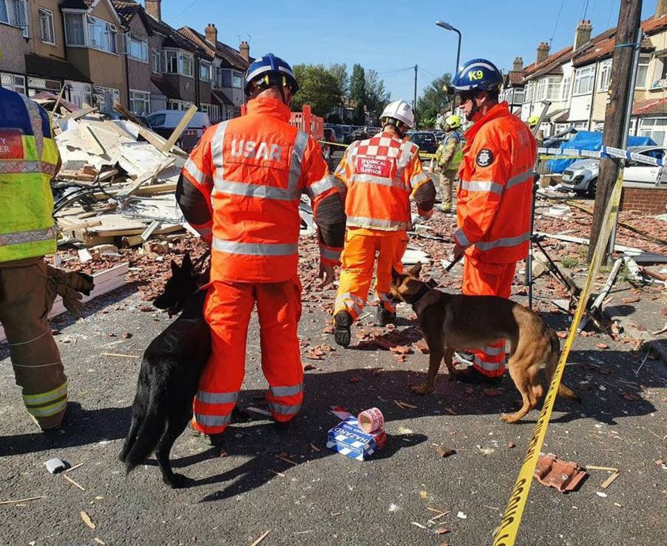 Rescuers at the scene in Galpin's Road, Thornton Heath, following the horror blast