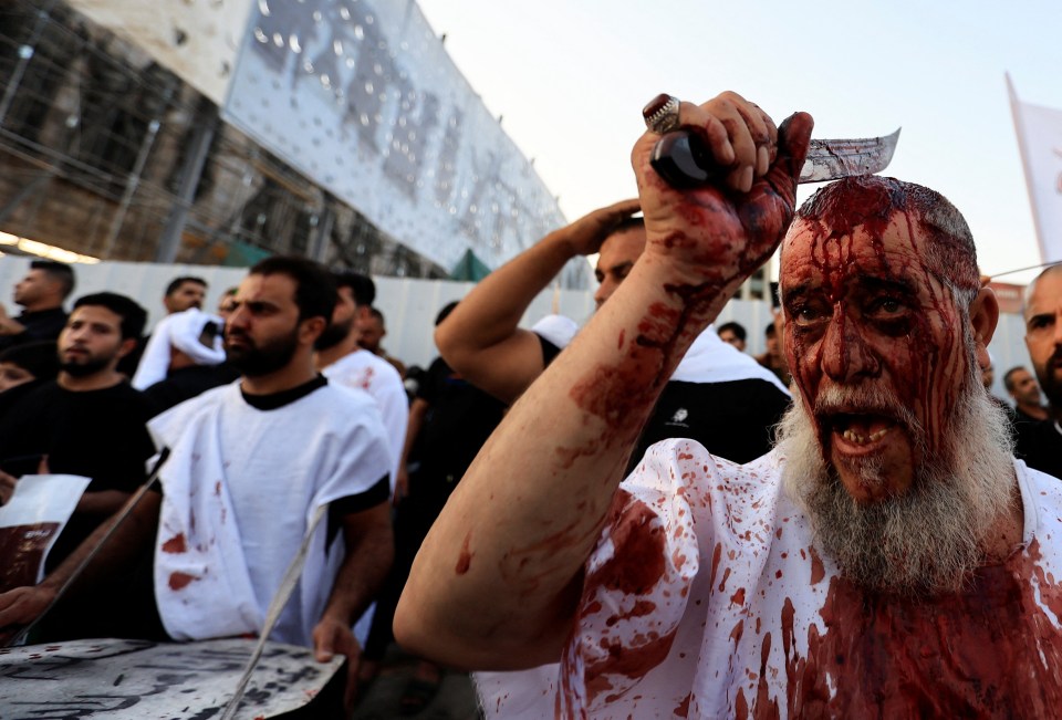 A devout Shiite Muslim gashes his head with blade during a ceremony marking Ashura in Tahrir Square, Baghdad