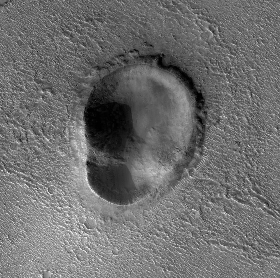 Scientists have discovered a large ear-shaped crater on Mars