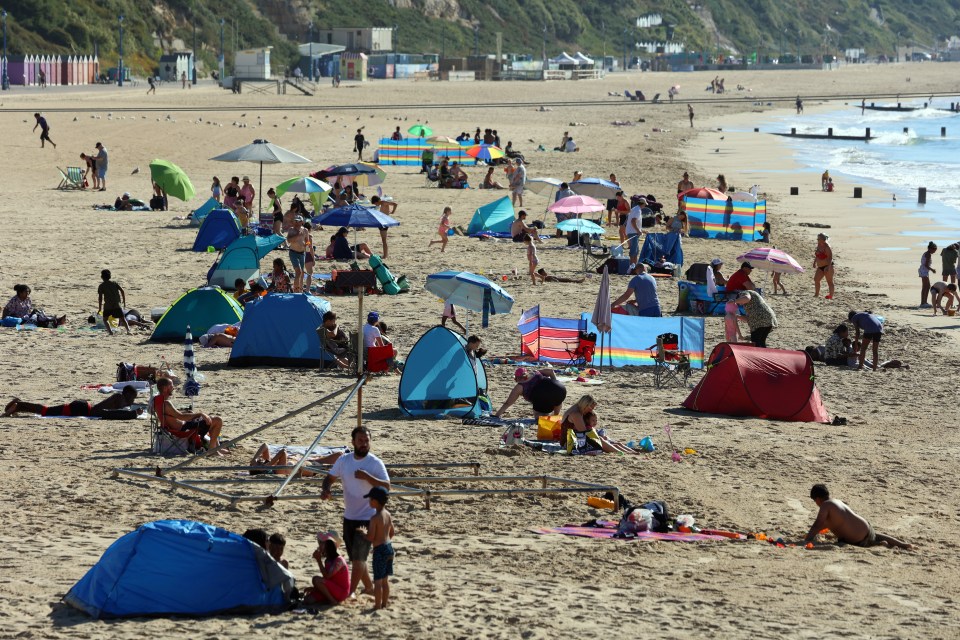 Beach-goers pack onto Bournemouth Beach, Dorset, to soak up the sun on Wednesday