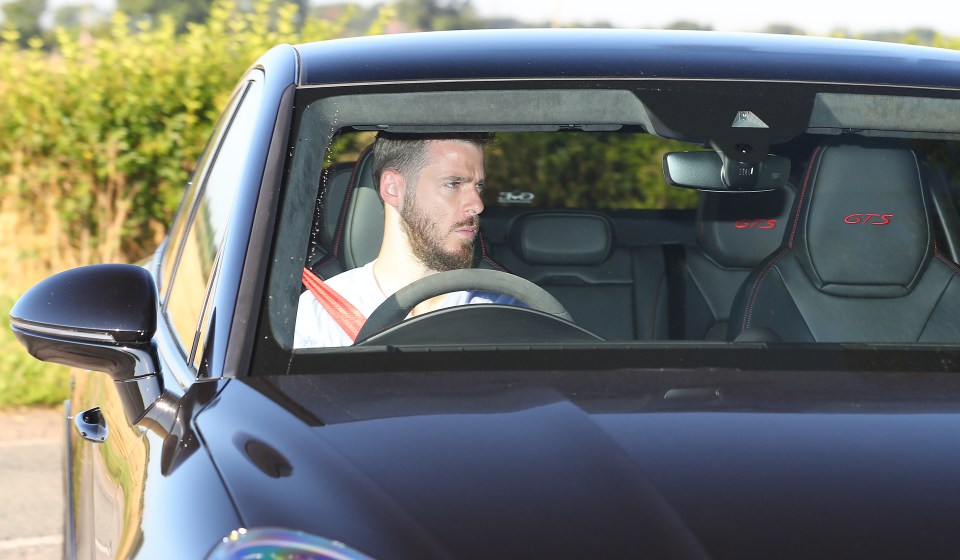 David de Gea wears a serious expression as he arrives at Carrington