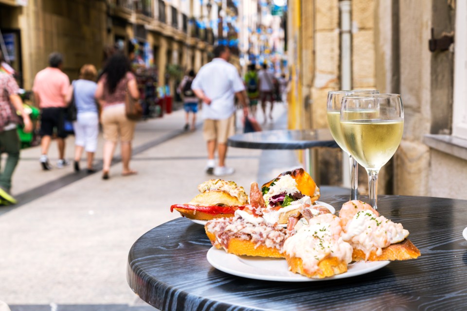 With its proud Basque heritage, in San Sebastian you’ll see locals in bars enjoying pintxos rather than tapas