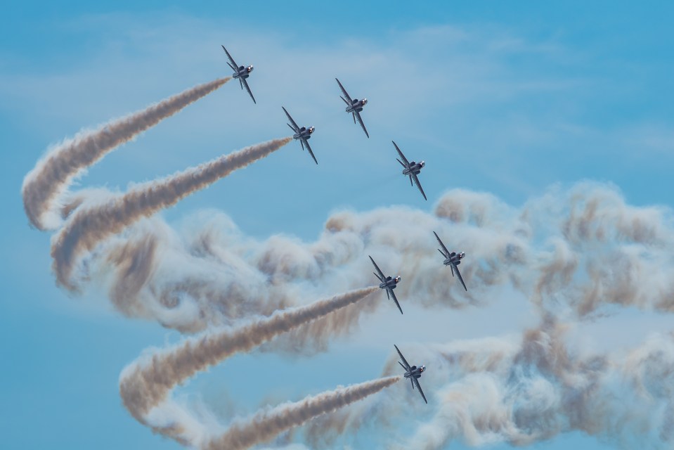 A pilot resigned in 'disgust' and a second one was sacked for an alleged affair - here are the Red Arrows on Saturday at Blackpool Airshow with just seven planes