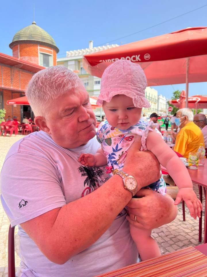 Daisy’s dad James, who was recovering from surgery and in a wheelchair, with his granddaughter