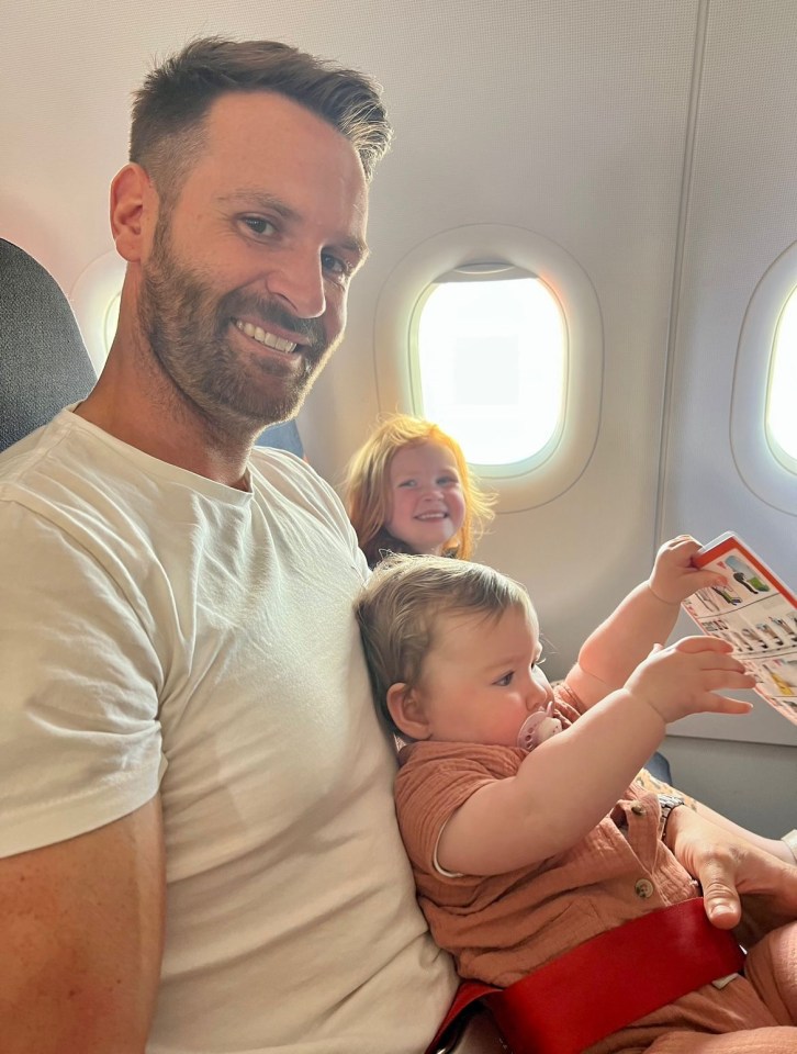 Daisy’s husband Dave with their two children on the flight to Faro, Portugal