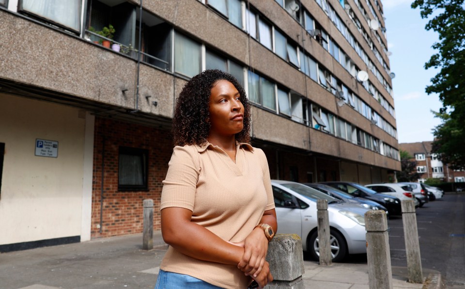 Ruth stands outside her Wandsworth flat