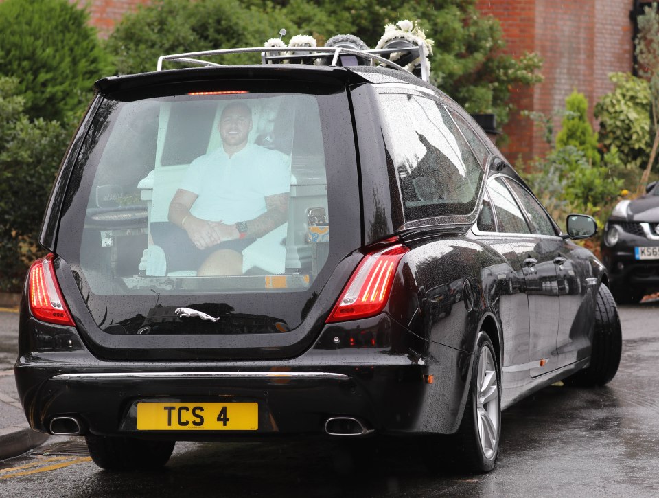 The hearse was decorated with floral tributes to Jake