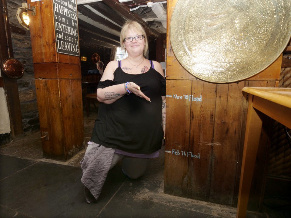 Hellyn demonstrates the extent of previous floods on the pub