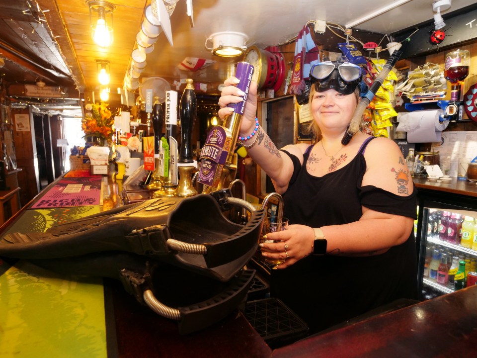 Hellyn pictured pulling pints in The Ship Inn