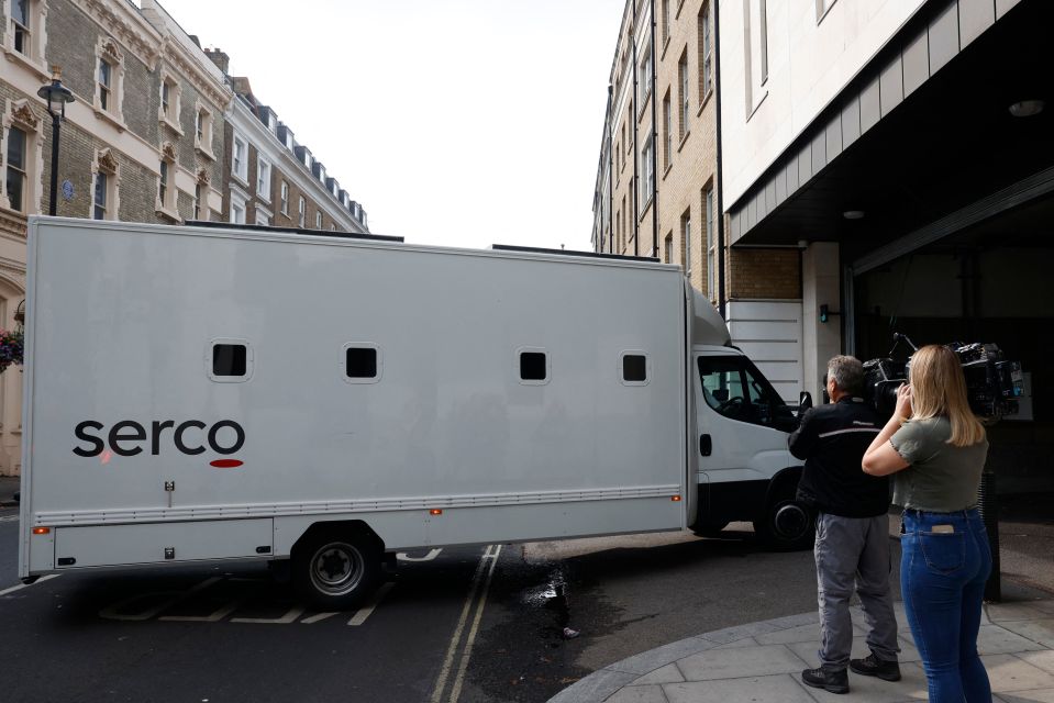 Journalists film a van believed to be transporting Chail to Westminster Magistrates’ Court in London