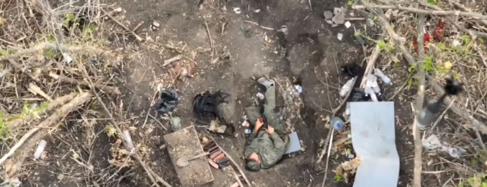 The alleged Ukrainian drone creeps up on the snoozing soldier who is conked out in his trench