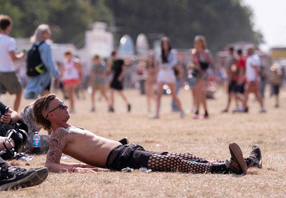 A punter takes a break to bask in the sunshine at Leeds Festival