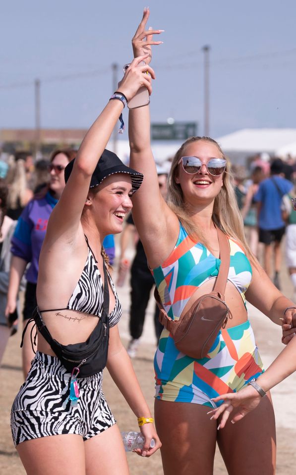 Festivalgoers celebrating there not being a raindrop in sight