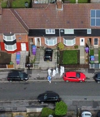 An aerial view of forensics officers at the scene in Knotty Ash