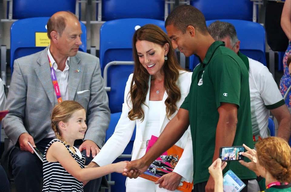 Charlotte shakes hands with Warren Lawrence of Team Jamaica