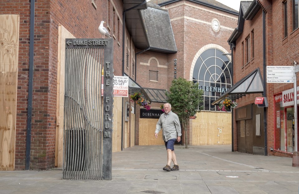 Now most of the town centre is boarded up and smashed