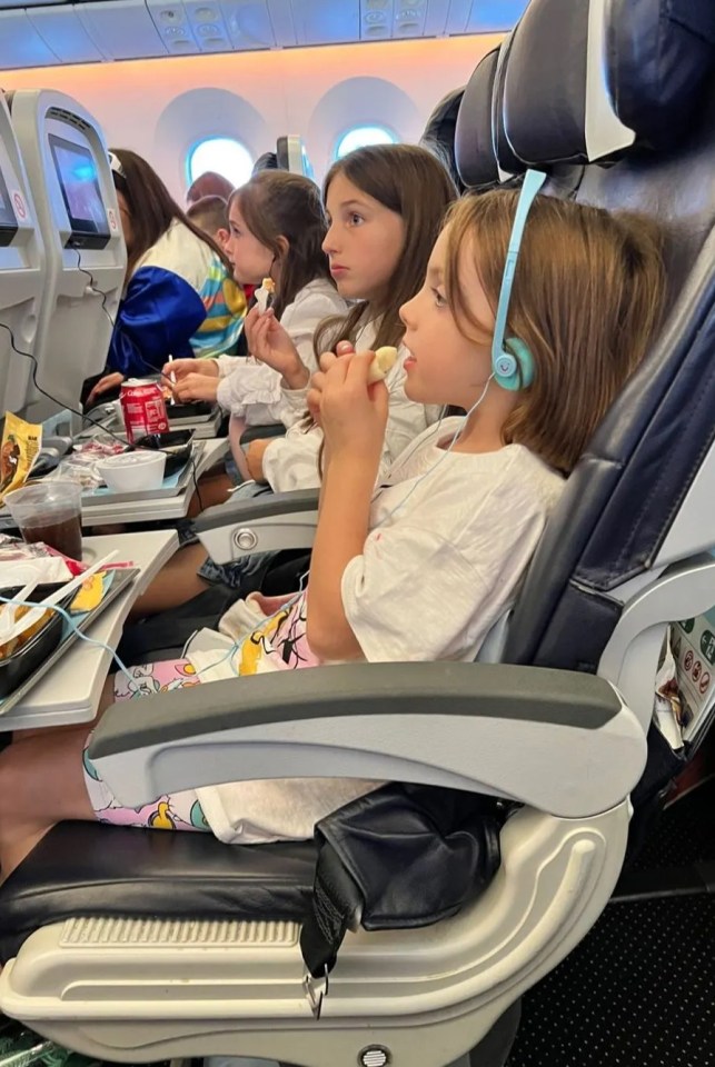 She shared numerous pictures of her littles ones on the flight and admitted flying for holidays can be a 'challenge'