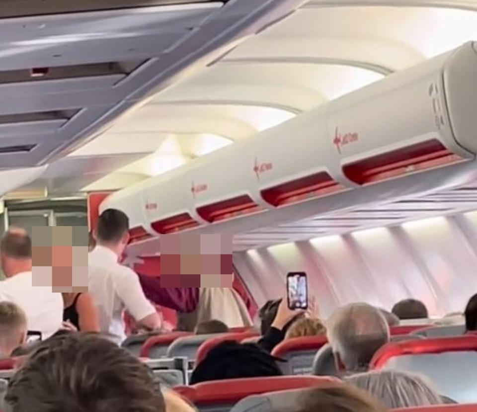 A woman yesterday slapped a Jet2 worker after he took away her gin and tonic