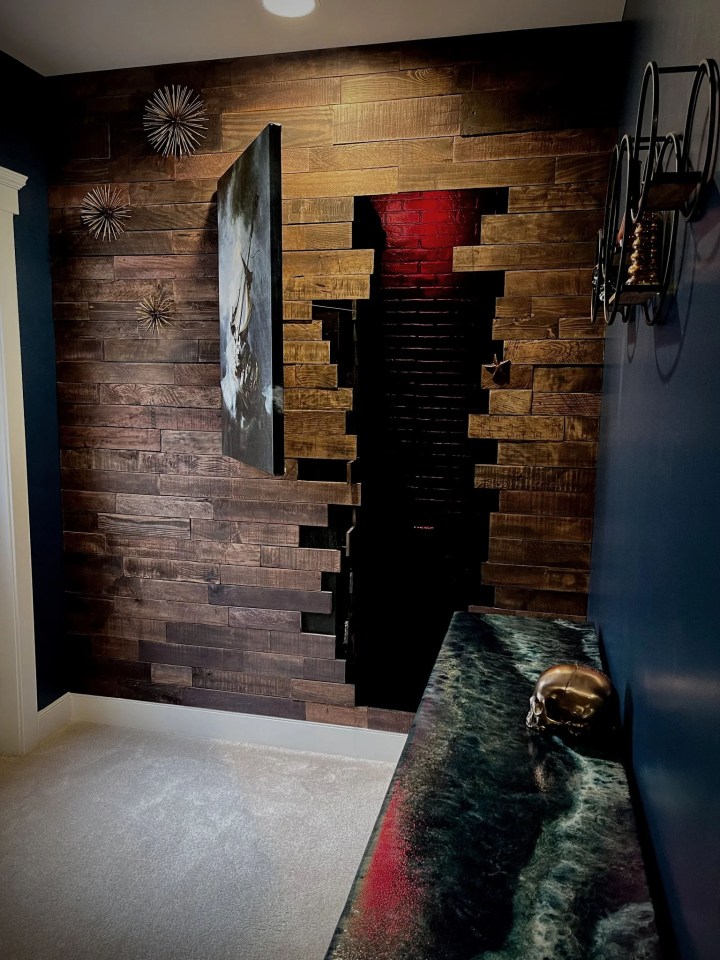 The fake door is made out of faux brick panels