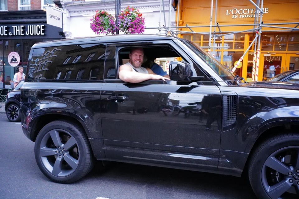 He was seen grinning in the £60k motor with Chloe in the passenger seat