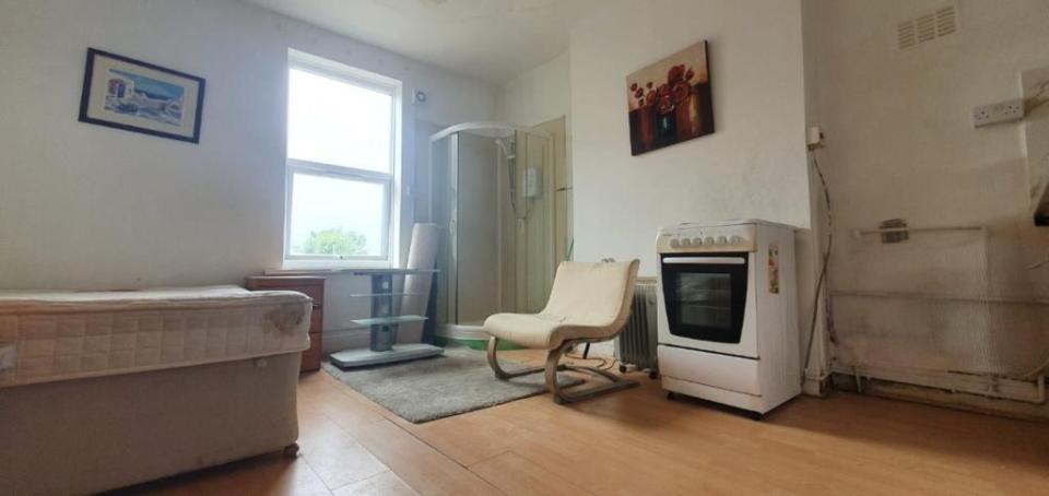 The supposedly "spacious" flat is so tiny that the shower is next to the bed