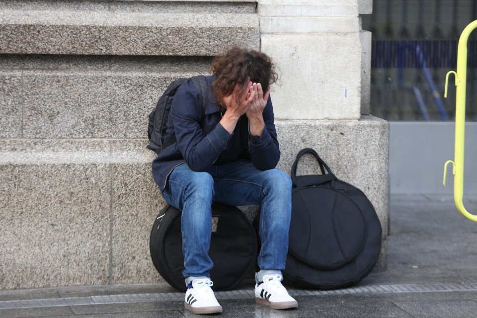 One exhausted traveller was seen with his head in his hands