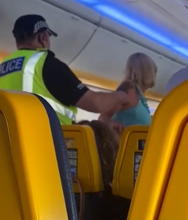 Police arrived to take her off the plane