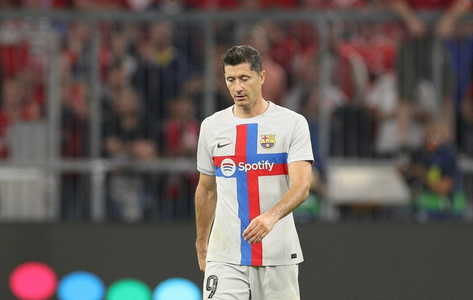 Robert Lewandowski looks dejected after defeat to his former club