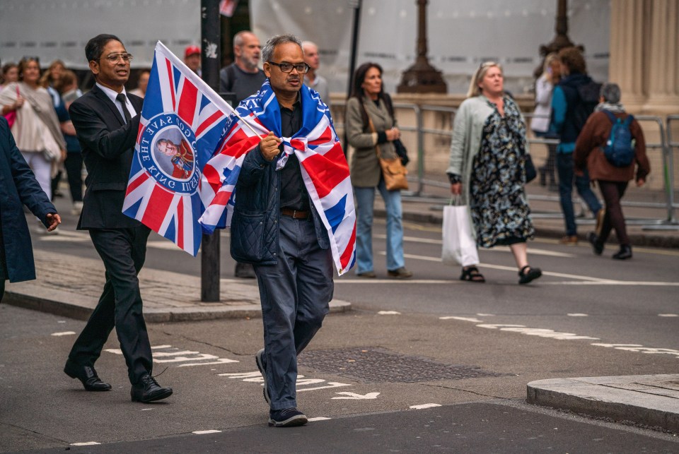 Mourners carrying Union Jack Flags