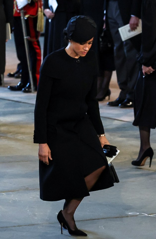 The Duchess curtseys as she arrives for the service