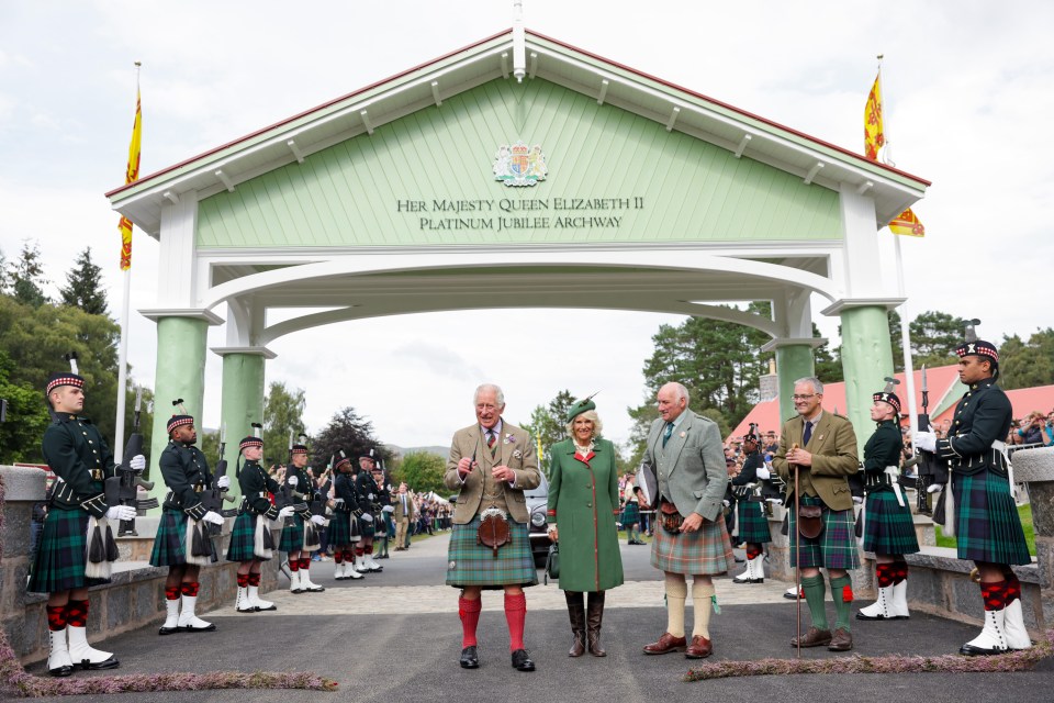 Charles, who is known as the Duke of Rothesay when in Scotland cuts a 'heather rope' to officially open The Queen Elizabeth Platinum Jubilee Archway