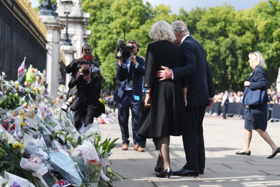 Charles also paused to look at floral tributes to his mother while with Queen Camilla