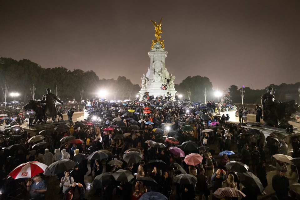 Despite the rain, the crowd stayed outside the Palace well into the night