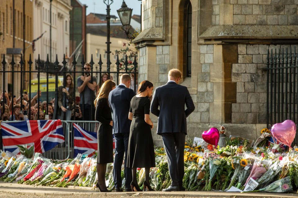 The Fab Four looked at the floral tributes laid outside Cambridge Gate at Windsor Castle