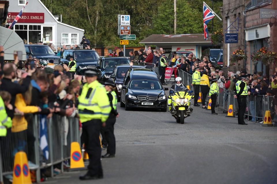 Police on guard during the emotional procession on September 11